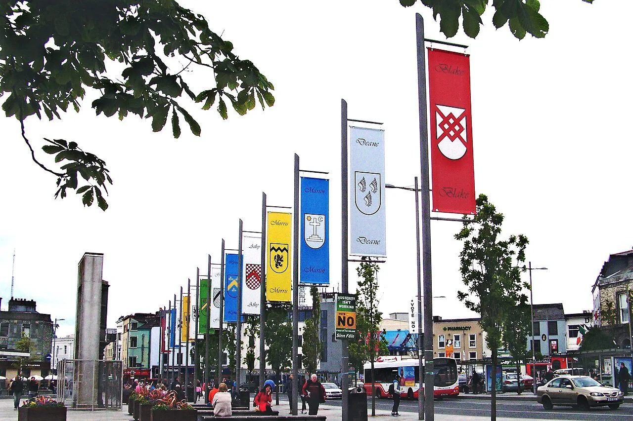 Banners representing Galway’s fourteen tribes at Eyre Square.