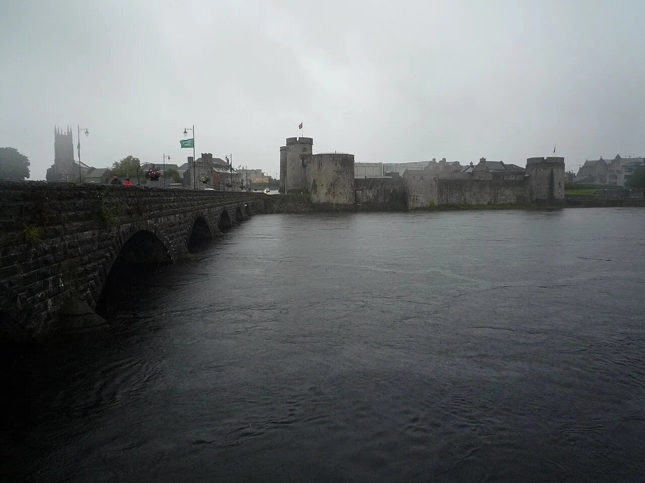 Thomond Bridge and King John's Castle in mist, Limerick.