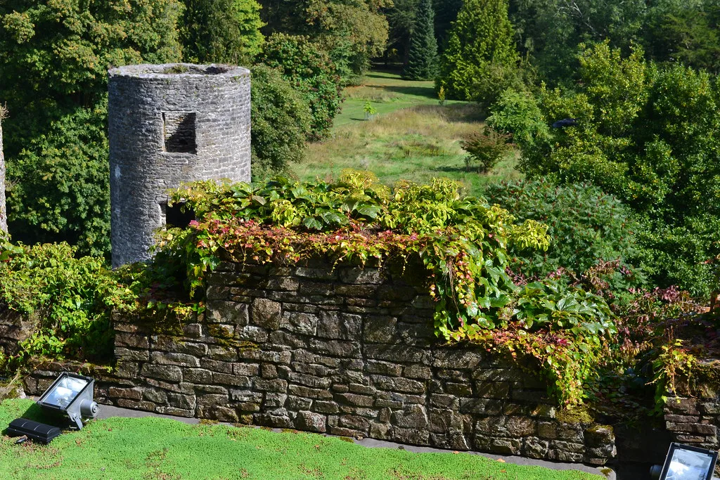 A tower and garden walls in the grounds of Blarney Castle.