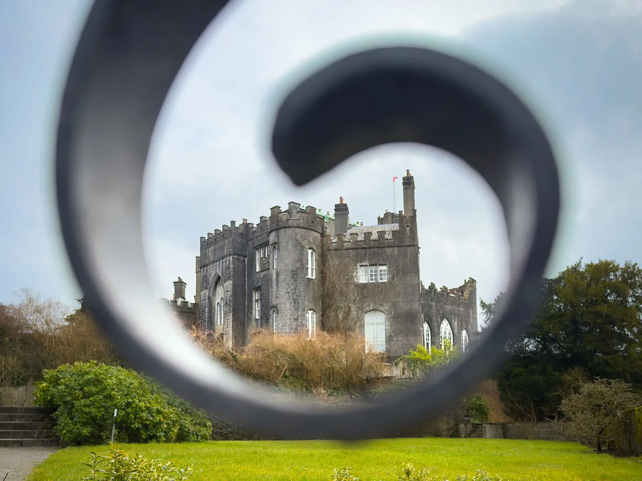 Birr Castle through a garden sculpture, County Offaly.
