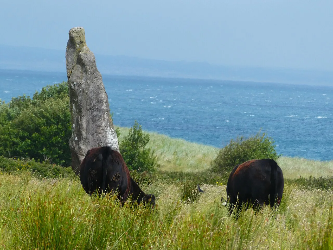 Standing stone above the sea on the Dingle Peninsula, County Kerry.